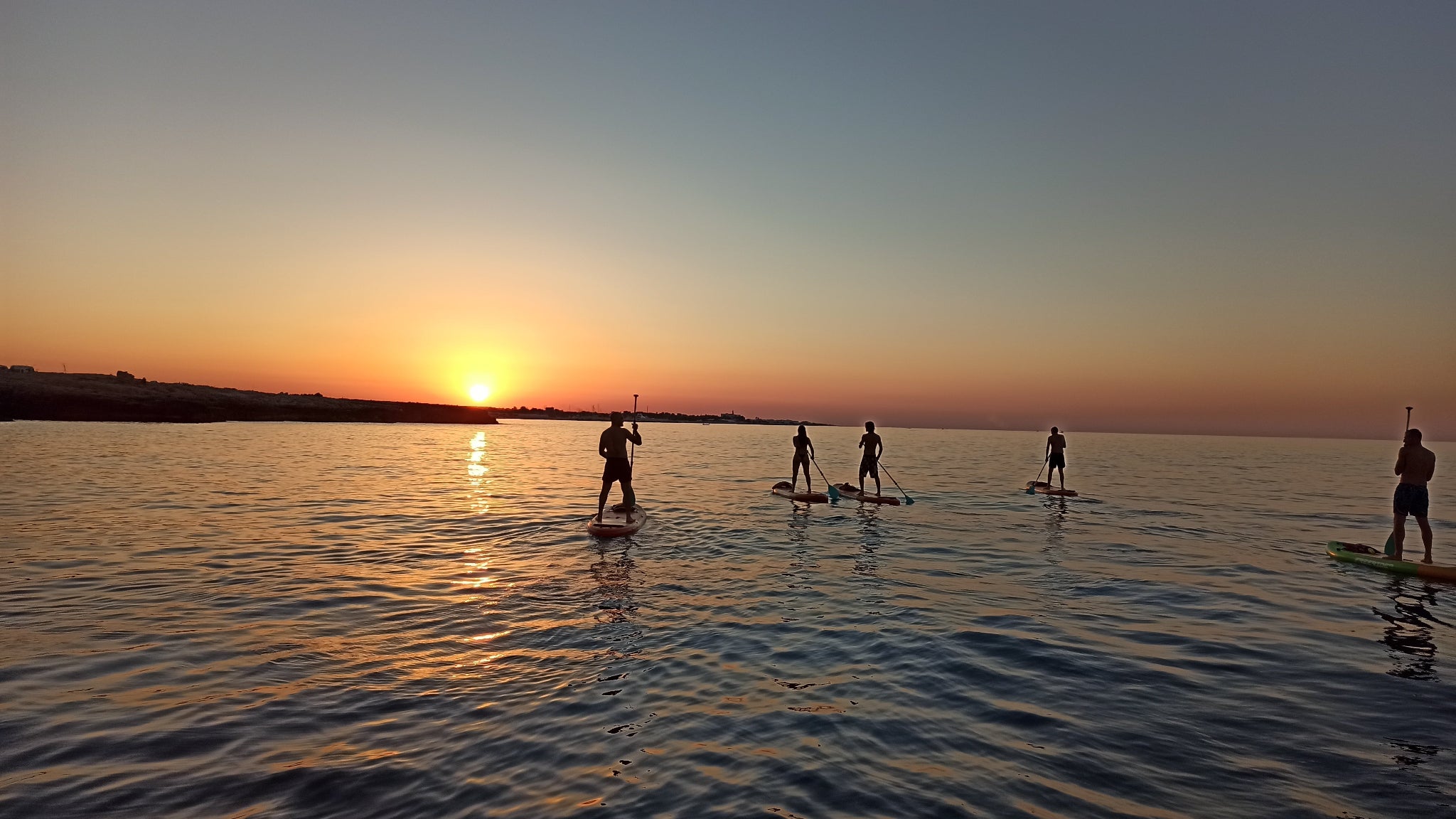 Escursione in SUP alle grotte di Polignano a Mare